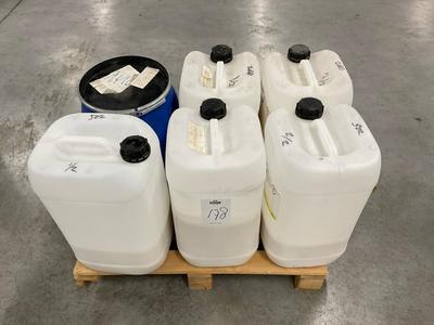 Overview picture of lot of  jerry cans with various coatings, 9 pieces